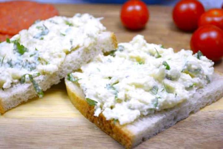 Homemade European creamy cauliflower spread and cold dip served on bread with charcuterie.