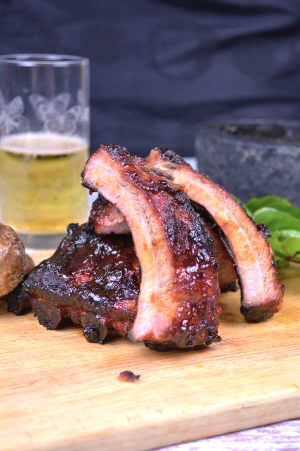 Honey Glazed Pork Ribs-Grilled Pork Ribs Served on Chopping Board With Beer