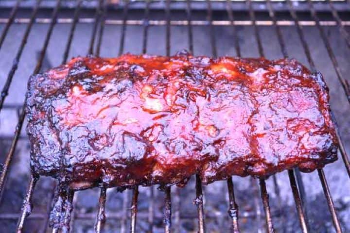 Close-up of tender fall-off-the-bone honey glazed pork ribs with a sticky caramelized crust.