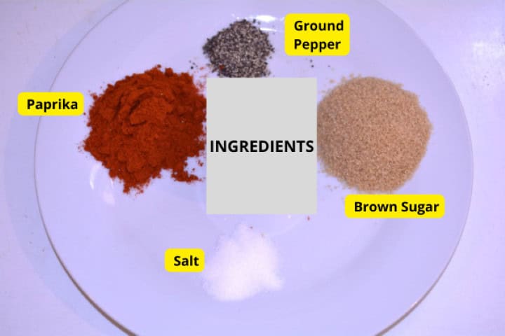 Ingredients for grilled honey glazed pork ribs: honey, brown sugar, paprika, sea salt, black pepper, and olive oil.