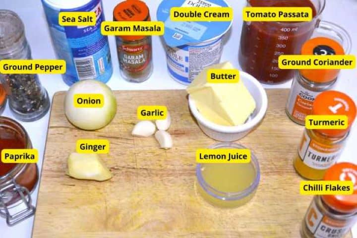 Creamy butter chicken recipe sauce base ingredients on the table.