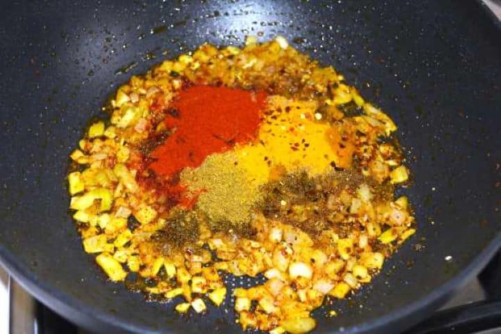 Seasoning the frying onions in the pan.