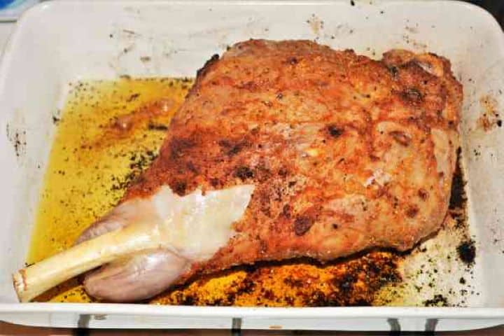 Slow Roasted Leg of Lamb Recipe-Pre-Roasted Lamb Leg Searing the leg of lamb at high heat in the oven to create a golden-brown caramelized crust.