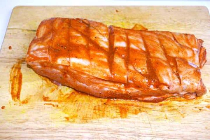 Pork belly skin scored in a diamond pattern and coated with sweet honey garlic glaze.
