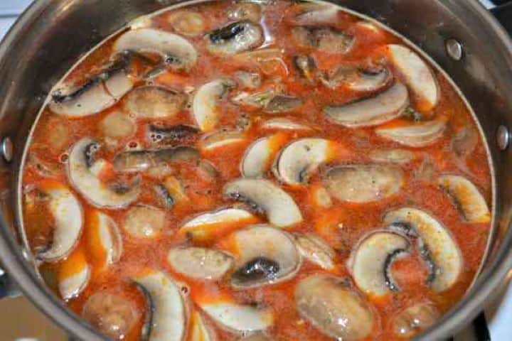 Best Mushroom Soup Recipe-Boiling Mushroom Soup Hungarian mushroom soup simmering in a pot in a rich golden-red paprika broth.