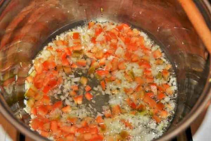 Best Mushroom Soup Recipe-Frying Chopped Onions and Bell Pepper in the Pot Sautéing diced onions and sweet red bell pepper in sunflower oil in a large soup pot.