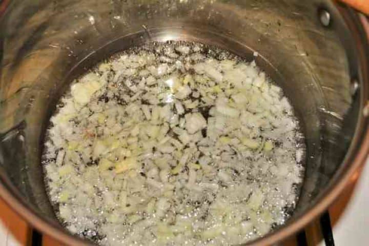 Best Mushroom Soup Recipe-Frying Chopped Onions in the Pot Sautéing diced onions in sunflower oil in a large soup pot.
