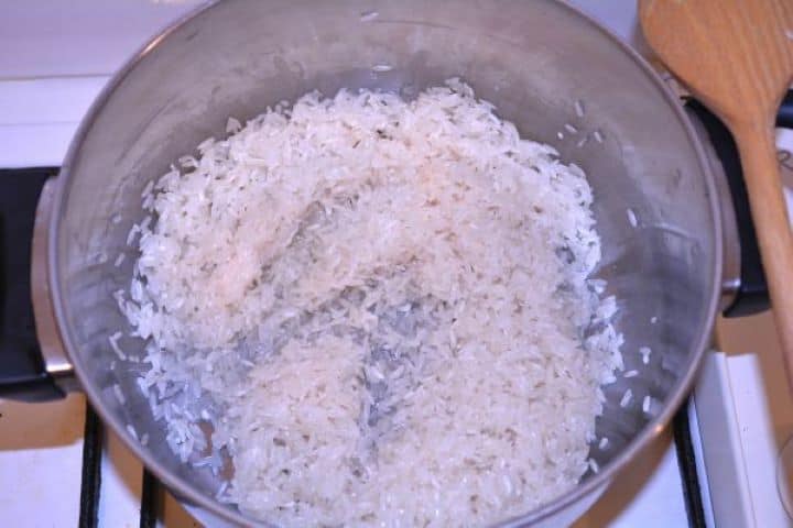 Layered Sauerkraut Casserole-Frying Rice in the Pot Sautéing white rice in sunflower oil in a small saucepan until slightly translucent.