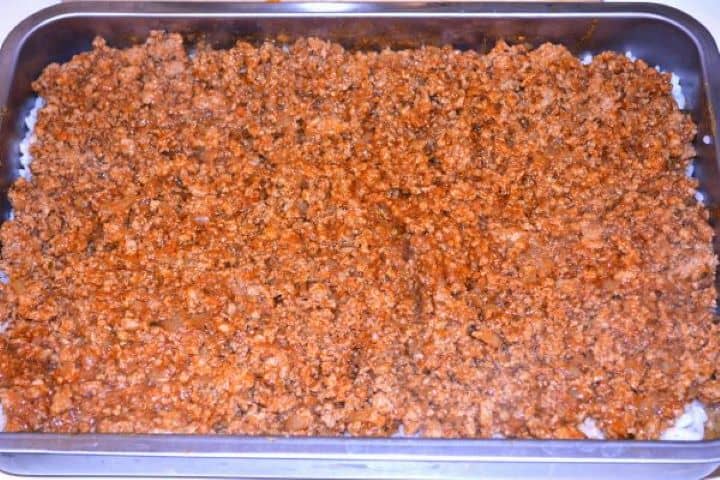 Layered Sauerkraut Casserole-Pork Mince is the Third Layer in the Baking Dish Adding a generous third layer of seasoned cooked pork mince over the rice.