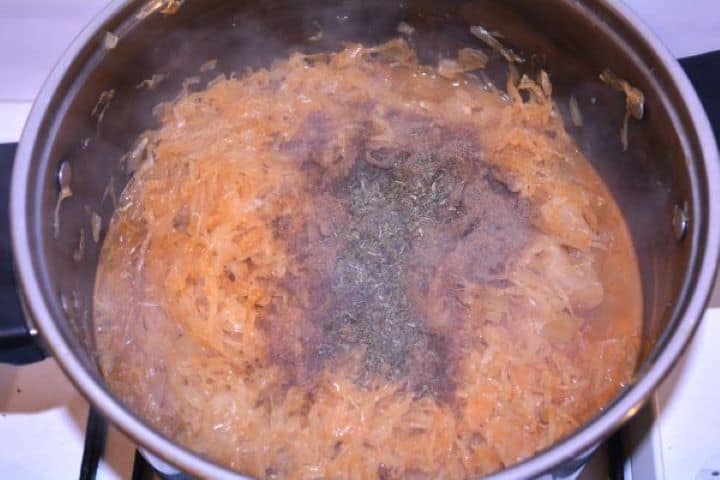 Layered Sauerkraut Casserole-Seasoned Cooked Sauerkraut in the Pot Seasoning the sauerkraut with summer savory and ground caraway in the pot.
