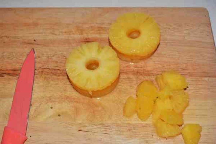 Chicken Breast With Pineapple-Pineapple Slices Cut in Cubes Cutting canned pineapple slices into bite-sized cubes for the salad base.