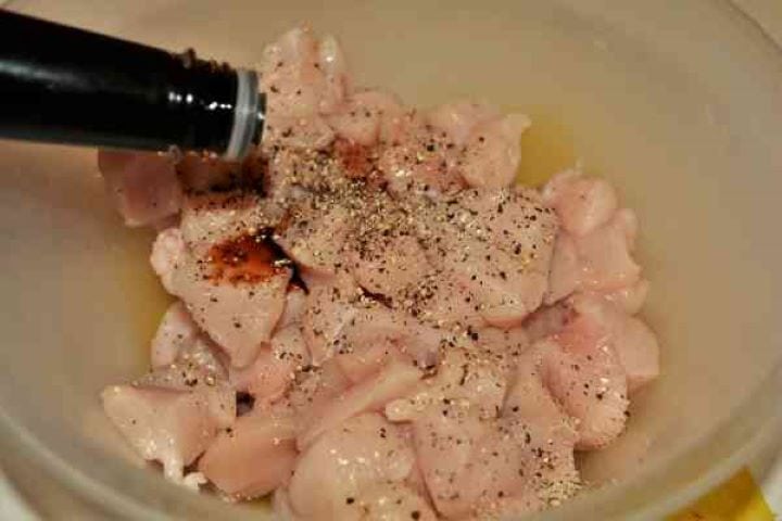 Chicken Breast With Pineapple-Seasoning Chicken Cubes With Ground Pepper and Soy Sauce Seasoning diced chicken breasts with dark soy sauce, sea salt, black pepper, and garlic powder in a bowl.