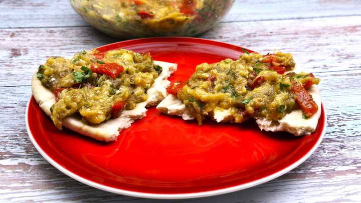 Greek Egplant Dip Spreaded on Pita Bread on the Plate