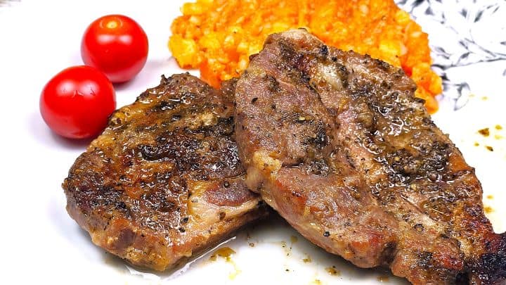 Easy Oven Baked Pork Steak Recipe-Served on Plate With Mashed Potatoes Oven-Baked Pork Steak Served on Plate With Mashed Potatoes