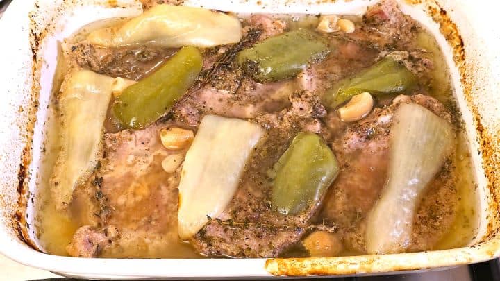 Easy Oven Baked Pork Steak Recipe-Pork Neck is Half Ready Slow Roasted Pork Steaks in the Ceramic Tray