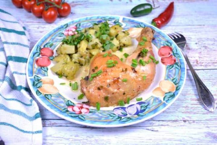 Serve Crispy garlic butter spatchcock chicken portion served on a plate with potato salad.