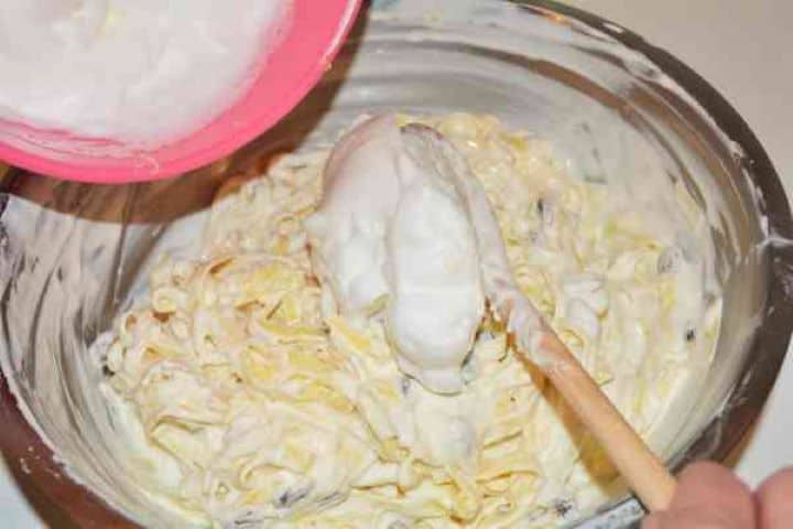 Noodle Kugel With Raisins-Adding Egg Whites Foam Over the Mixed Tagliatelle and Cheese Cream Adding Egg Whites Foam Over the Mixed Tagliatelle and Cheese Cream