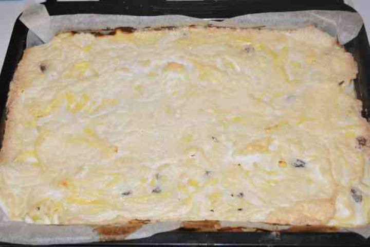 Noodle Kugel With Raisins-Baked Cake in the Tray Ready to Serve Sweet Noodle Kugel With Raisins in the Tray Ready to Serve