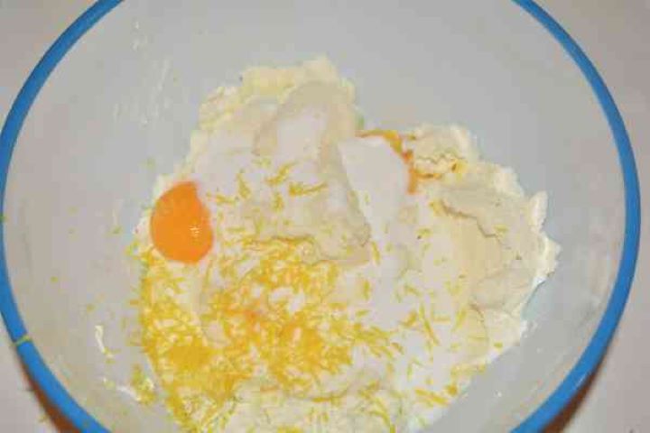 Noodle Kugel With Raisins-Cheese Cream, Egg Yolks, Lemon Zest, Sugar and Vanilla in the Bowl Cheese Cream, Egg Yolks, Lemon Zest, Sugar and Vanilla in the Bowl