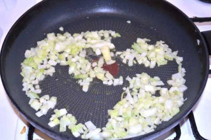 Onion Sautéing diced yellow onions in extra virgin olive oil in a frying pan over medium heat.