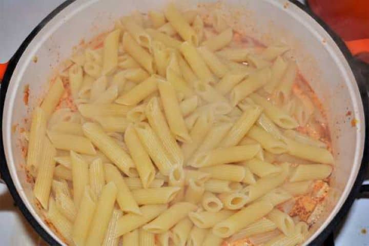 Boiled penne pasta tossed directly into creamy pork mince sauce.