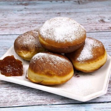 Perfect Yeast Doughnuts Served on Plate With Strawberry Jam