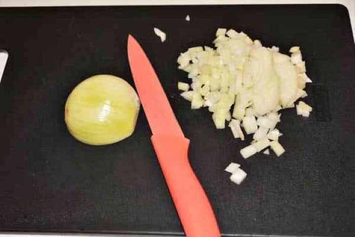 Chopped Onion Finely diced yellow onion prepared for sautéing in olive oil.