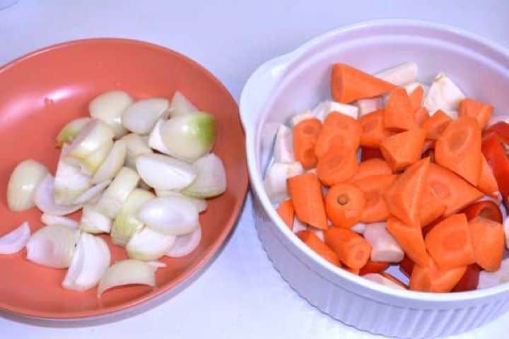 Chopped root vegetables, carrots, and celery root ready for stewing.