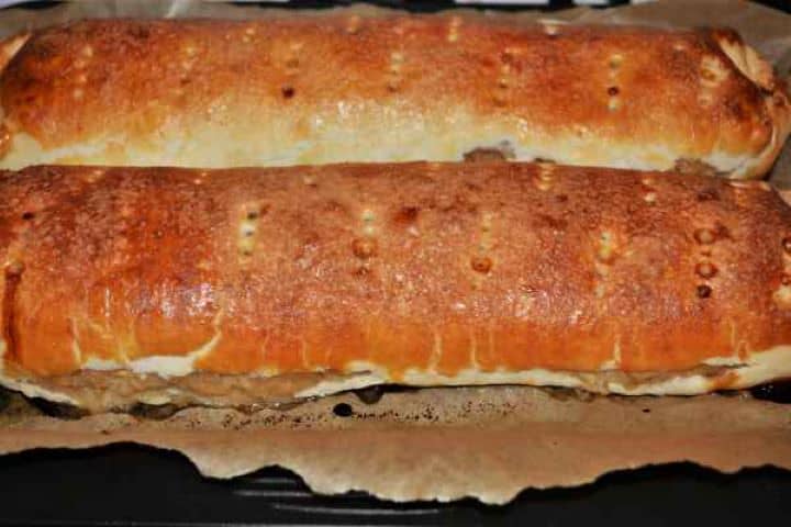 Apple Shortcrust Pastry Recipe-Baked Rolled Shortcrust Pastry in the Baking Tray Deep golden brown, fully baked apple shortcrust pastry rolls cooling in a baking tray.