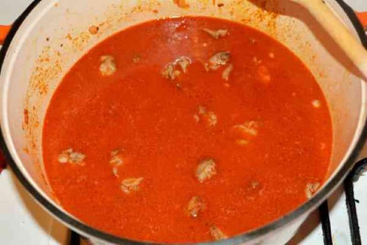 Dutch Oven Beef Stew-Simmering Beef Stew A rich beef stew without carrots simmering low and slow in a red wine, grated tomato, and paprika reduction.