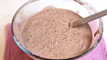 Smooth chocolate Swiss roll batter fully incorporated in a mixing bowl.
