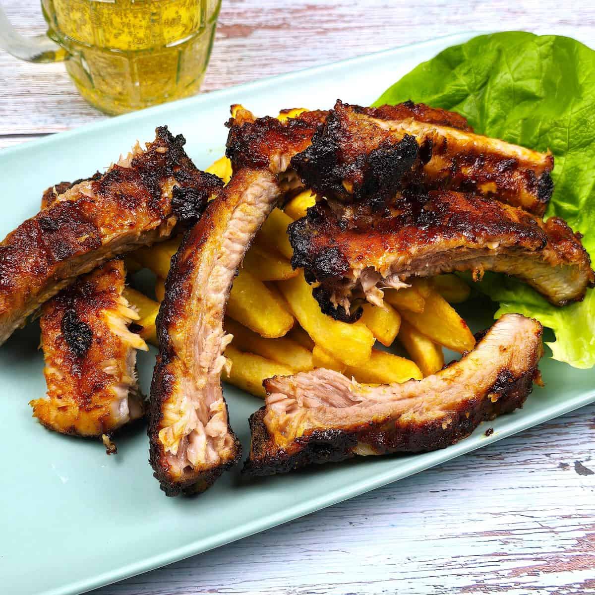 Air Fryer Pork Ribs Served on Plate With Fries