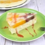 No Bake Crustless Cheesecake Slice Served on Green Plate With Strawberry Syrup