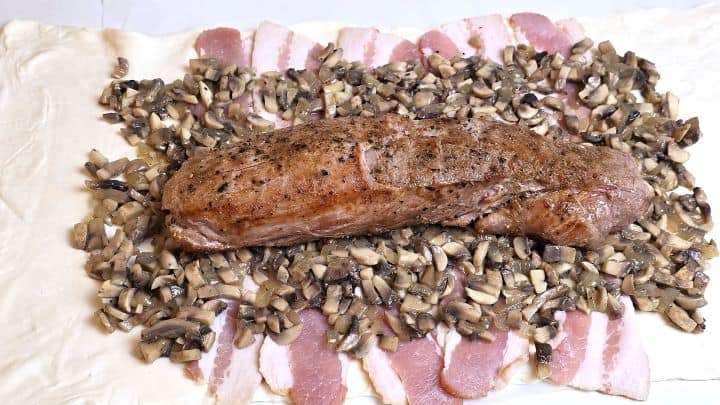 Pork Loin, Sauteed Mushrooms and Smoked Bacon Slices on the Puff Pastry