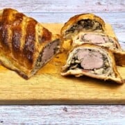 Three Pork Wellington Slices Served on Wooden Cutting Board