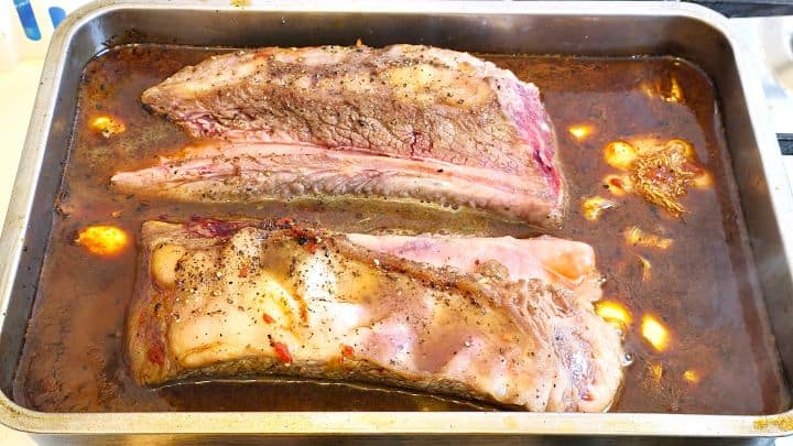 Fried Ribs in the Oven Tray With Garlic, Tomato Paste and Red Wine