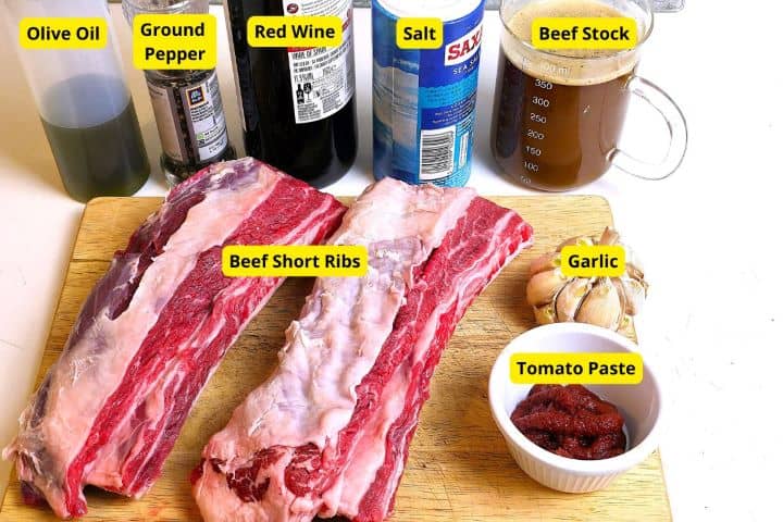 Beef Ribs, Salt, Pepper, Wine, Olive Oil and Beef Stock on the Table
