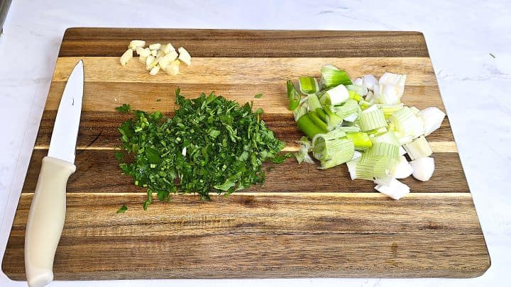 Chopped Parsley, Garlic and Spring Onion on the Cutting Board