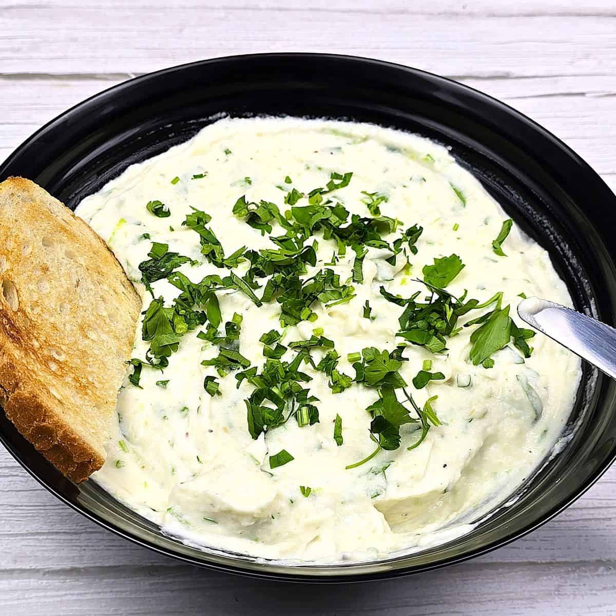 Celeriac Dip Served in Bowl With Toast and Parsley