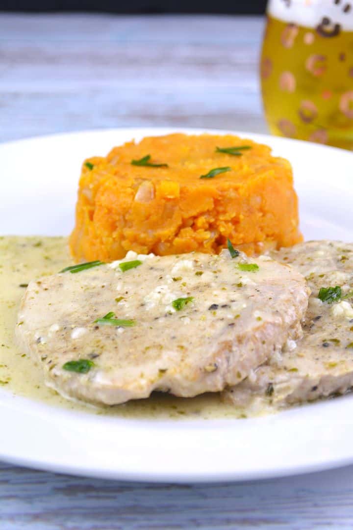 Creamy Garlic Pork Chops Served on Plate With Potatoes