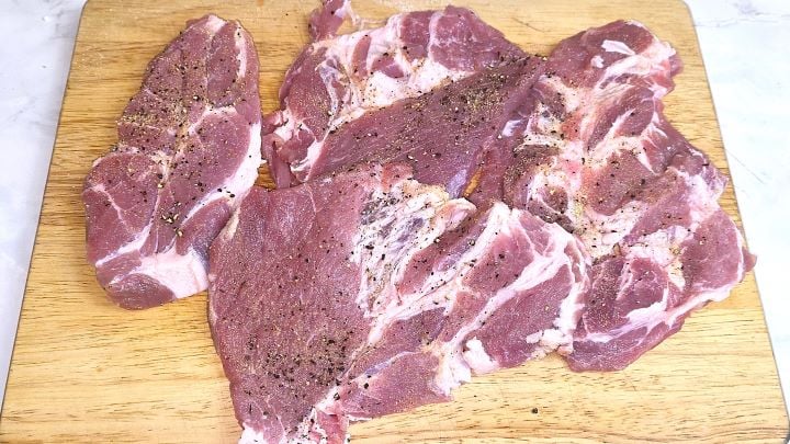 Seasoned Pork Shoulder Slices on the Chopping Board