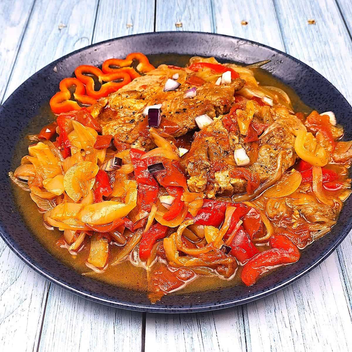 Hungarian Pork Pepper Stew Served on Blue Plate