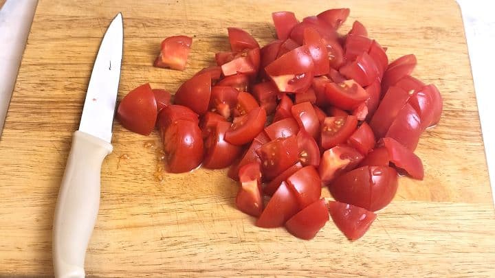 Tomatoes Cut in Cubes on the Chopping Board