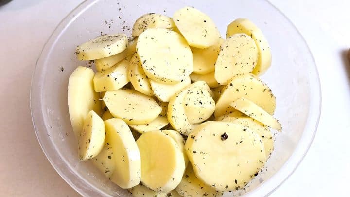 Sliced and Seasoned Potatoes in the Bowl