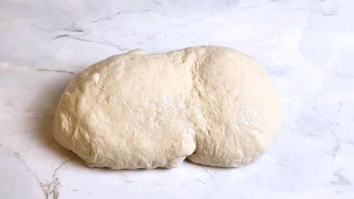 Rolled In Oval Form Bread Dough on the Table