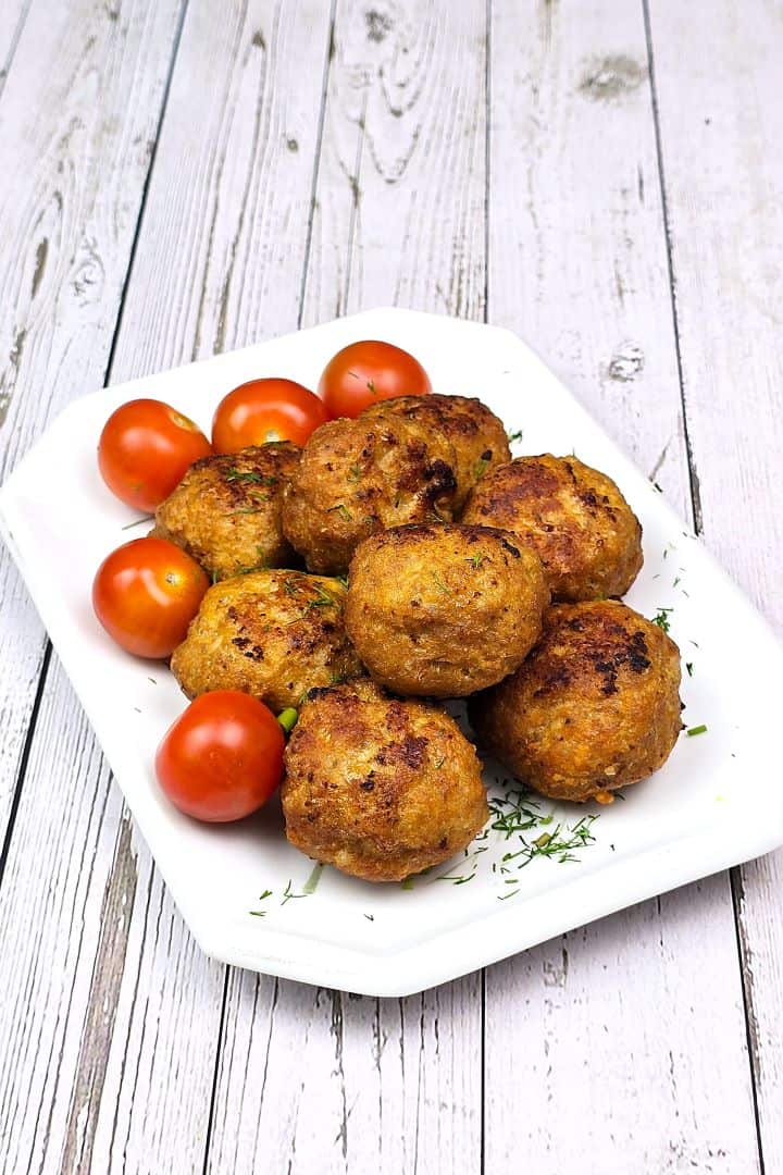 Hungarian Fried Meatball Served on Plate With Tomatoes