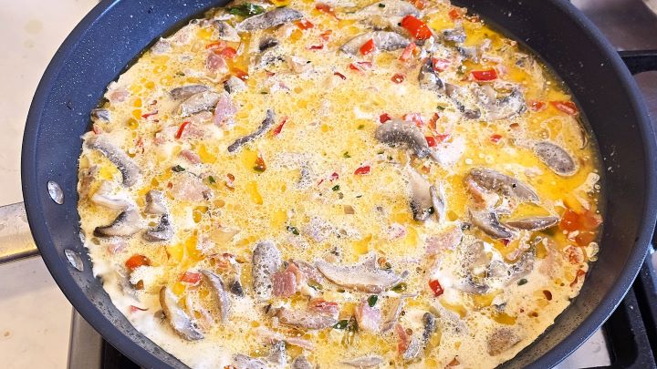 Sauteeing Mushrooms, Bacon and Vegetable With Double Crream in the Pan