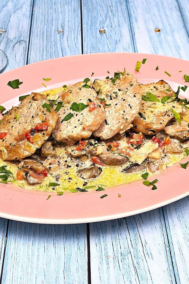 Pork Tenderloin in Creamy Mushroom Sauce Served on Oval Plate