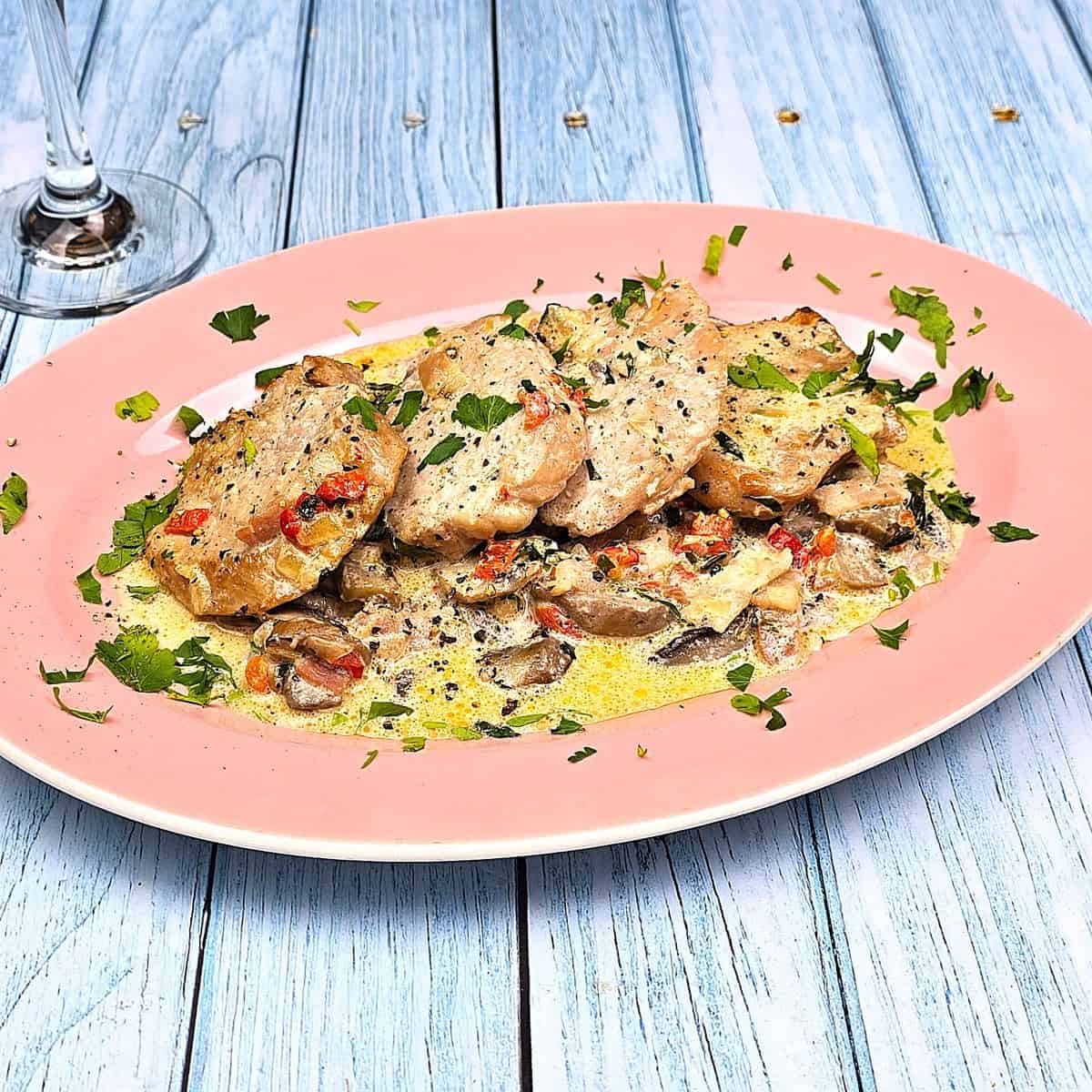 Pork Tenderloin in Creamy Mushroom Sauce Served on Oval Plate