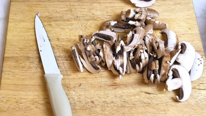 Sliced Mushrooms on the Chopping Board
